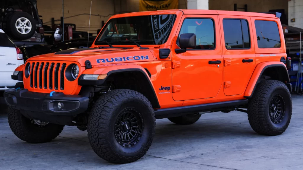 GMC pickup truck with all-terrain tires parked at tire service shop