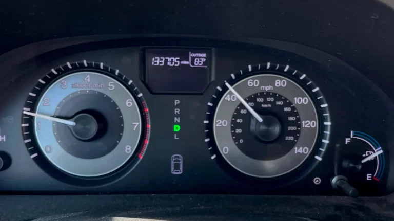 TPMS warning light illuminated on car dashboard instrument cluster