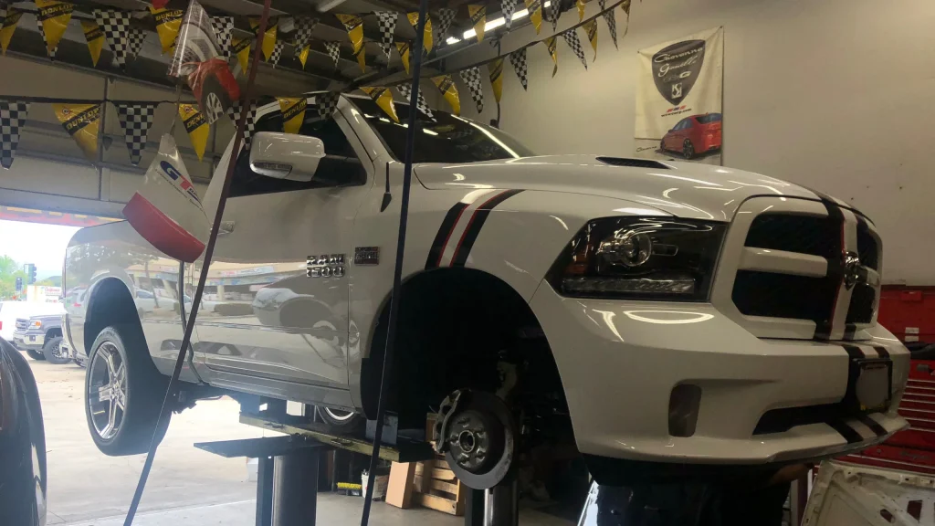 Vehicle suspension inspection during wheel alignment and maintenance service