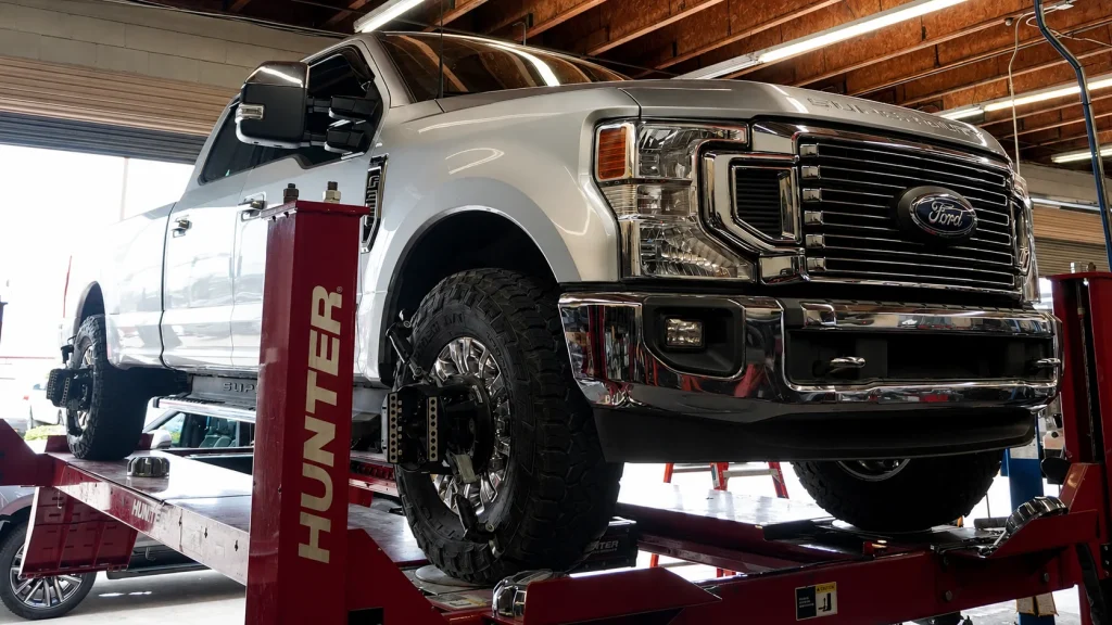 Fleet pickup receiving professional wheel alignment service in Ontario CA