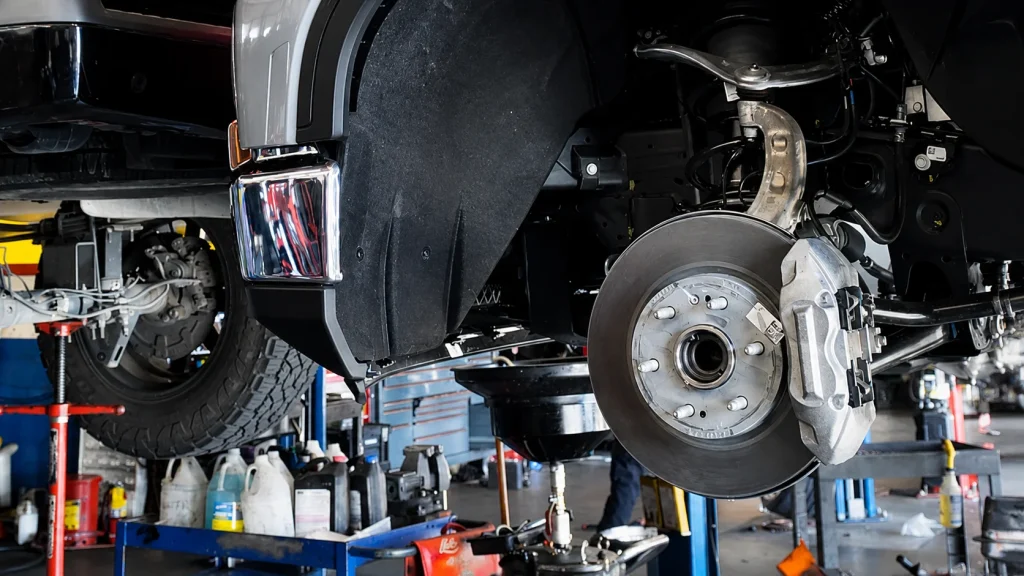 Fleet vehicle suspension and steering inspection with wheel removed