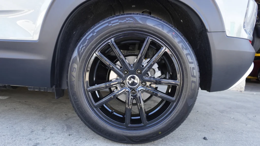 Tire and wheel fitment installed on an SUV at Comtires