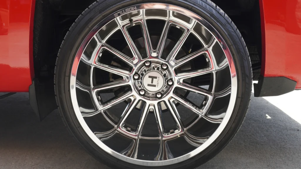 Close-up of an undamaged wheel lip and tire sidewall for comparison with signs of a bent rim.